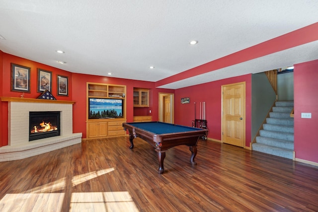 rec room featuring billiards, wood finished floors, baseboards, a fireplace, and recessed lighting