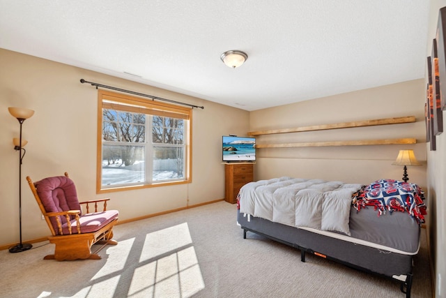 carpeted bedroom with baseboards