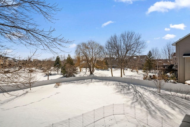 snow covered deck with fence