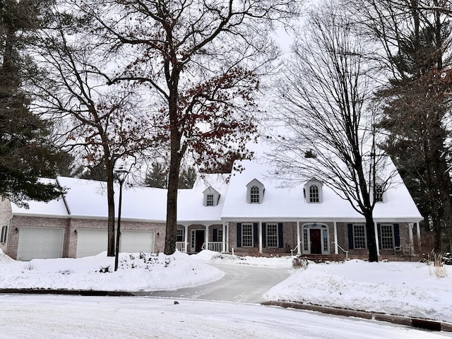 new england style home featuring brick siding