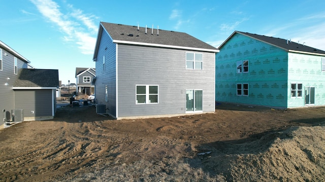 rear view of house featuring central AC unit