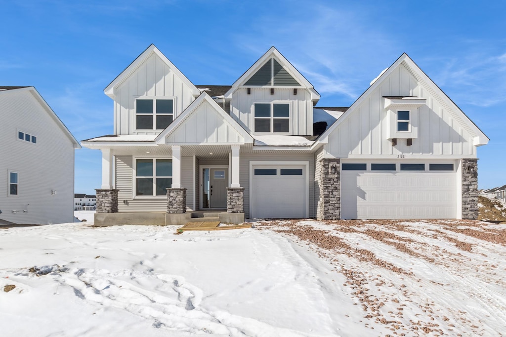 view of front facade with board and batten siding and stone siding