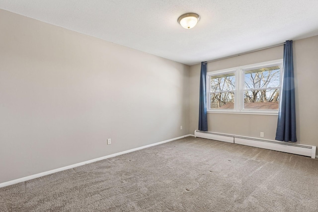 carpeted empty room featuring a textured ceiling, a baseboard radiator, and baseboards