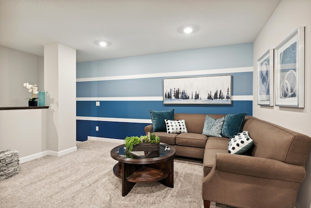 carpeted living room with recessed lighting and baseboards