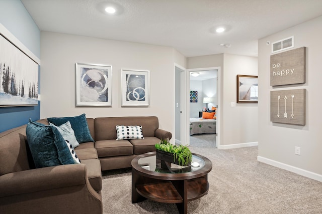 carpeted living area with baseboards, visible vents, and recessed lighting