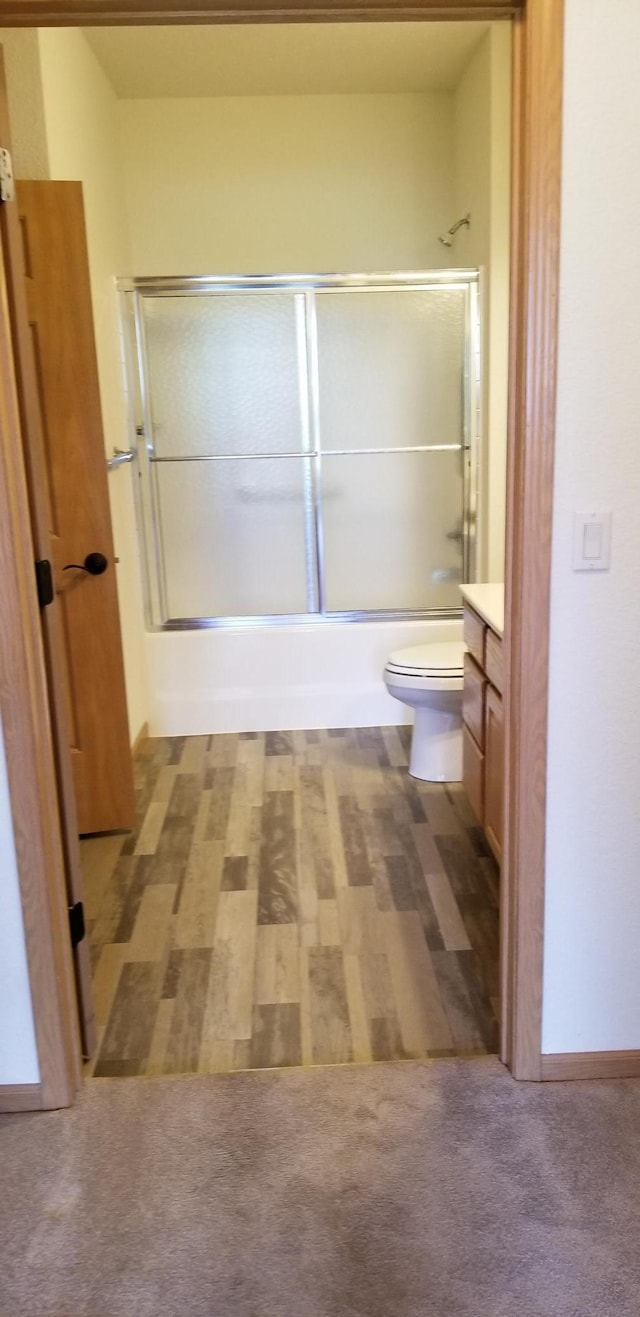 935 Ferndale St N Unit 106, Maplewood, MN 55119 - full bathroom with enclosed tub / shower combo, toilet, and vanity