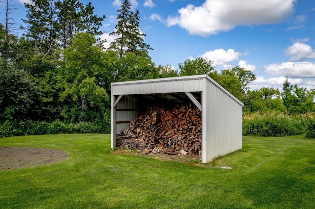 view of pole building with a lawn