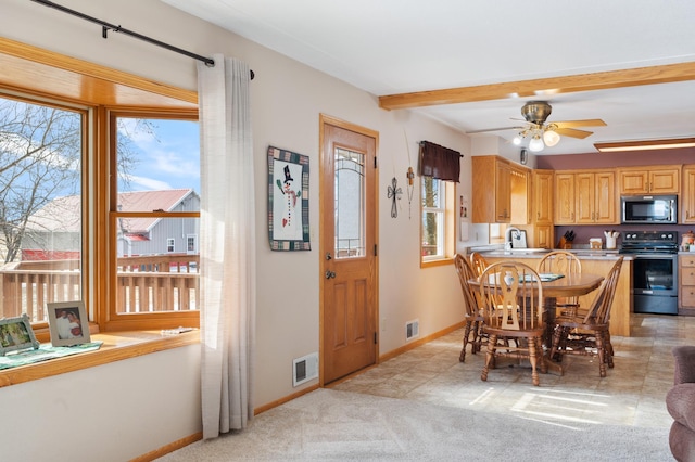 interior space with light carpet, beam ceiling, visible vents, and baseboards