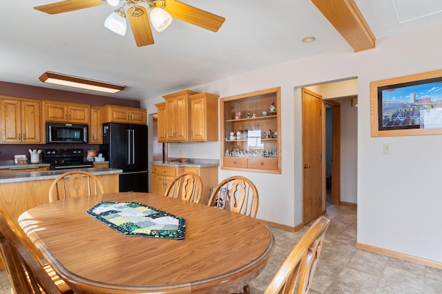 dining area with a ceiling fan and baseboards