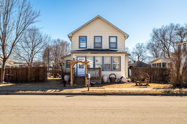 traditional home with fence