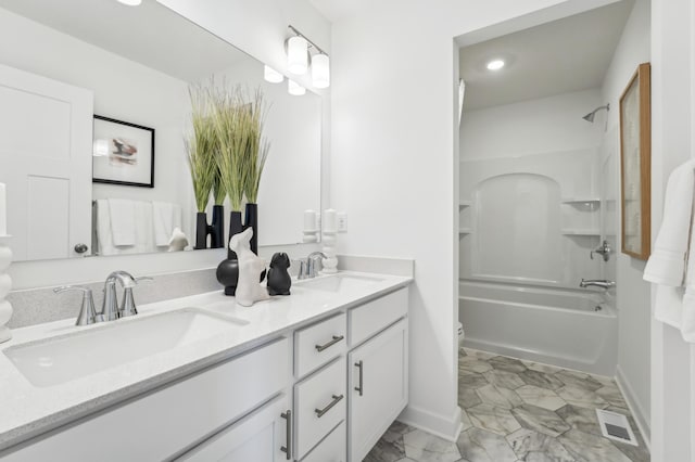 full bathroom with visible vents, a sink, toilet, and double vanity