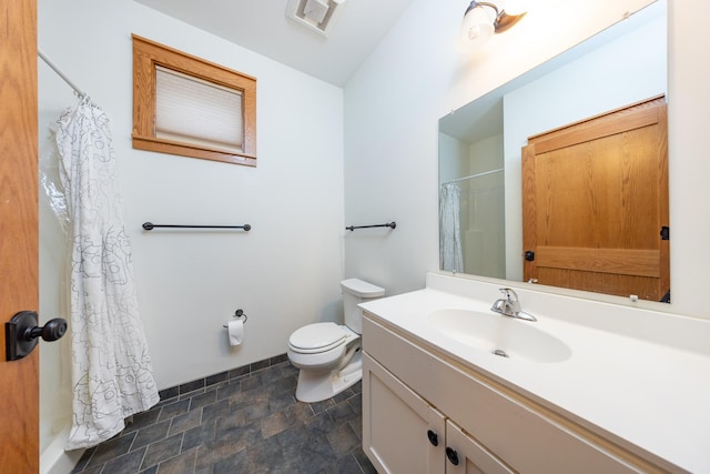 full bath with baseboards, visible vents, toilet, stone finish floor, and vanity