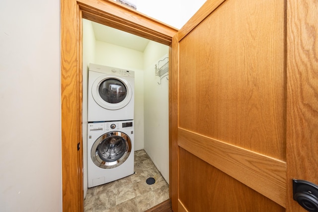 washroom featuring stacked washing maching and dryer and laundry area