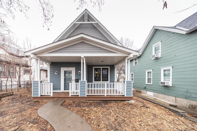 view of front of property with covered porch and cooling unit