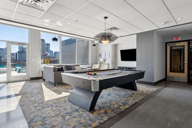 playroom with a paneled ceiling, baseboards, and visible vents