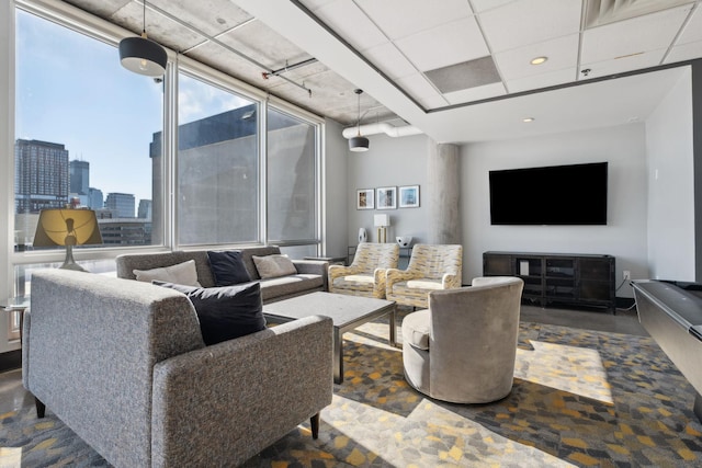 living area with a city view and recessed lighting