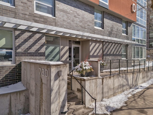 exterior space featuring brick siding