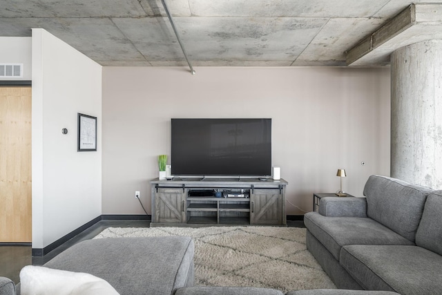 living area with visible vents and baseboards