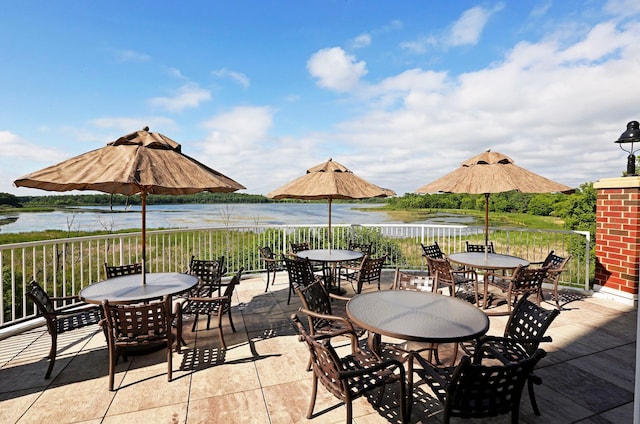 view of patio / terrace featuring outdoor dining area and a water view