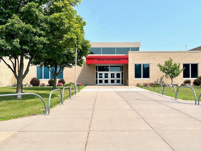 view of building exterior with concrete driveway