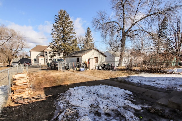 exterior space with an outbuilding and fence private yard