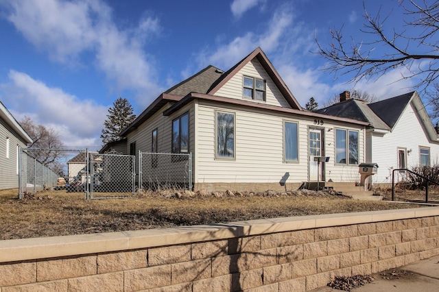 view of front of house with a gate and fence