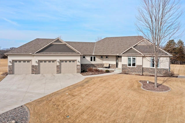 craftsman inspired home with driveway, roof with shingles, an attached garage, a front lawn, and stone siding