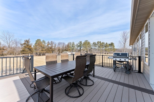 deck with area for grilling and outdoor dining space