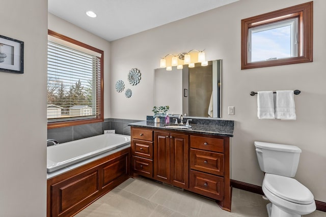 full bathroom with a bath, tile patterned flooring, toilet, and vanity