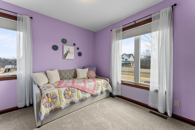 bedroom with visible vents, carpet floors, and baseboards