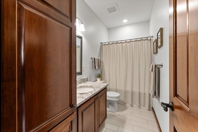 full bath with vanity, tile patterned floors, and toilet