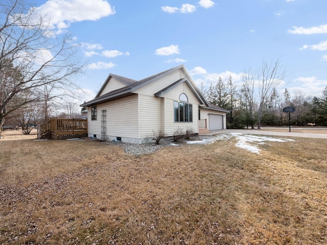 view of home's exterior with a wooden deck and an attached garage