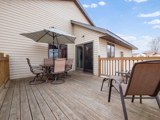 wooden deck featuring outdoor dining area