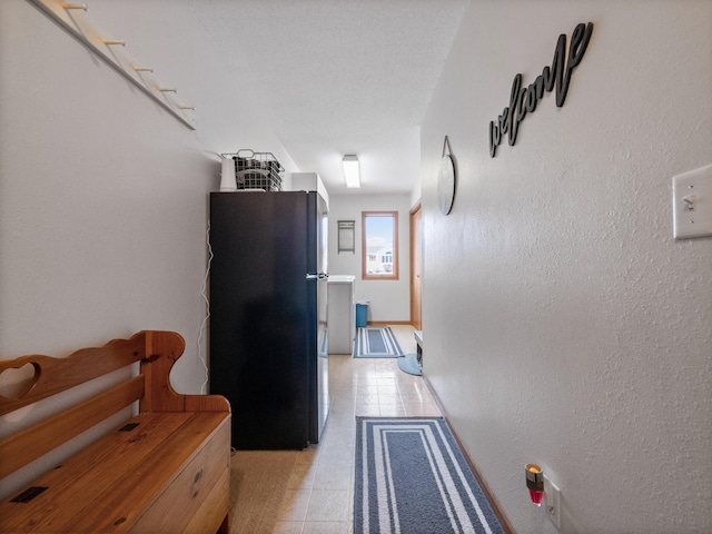 hallway with light tile patterned flooring