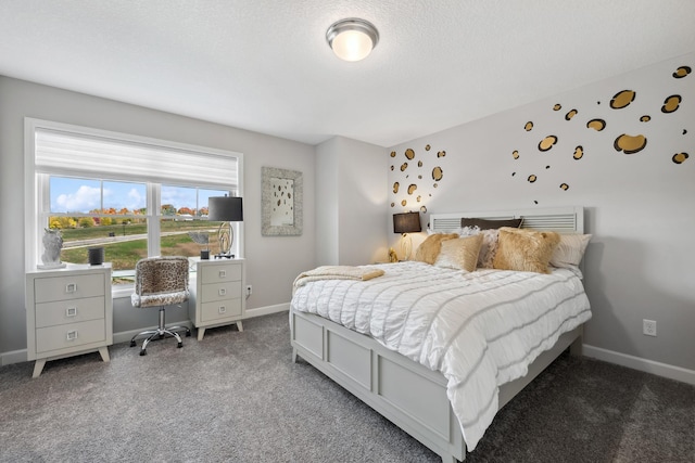 carpeted bedroom with baseboards and a textured ceiling