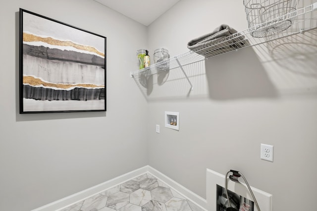 washroom featuring laundry area, hookup for a washing machine, baseboards, and marble finish floor