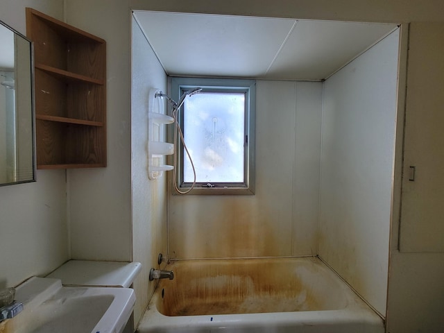 bathroom featuring bathtub / shower combination and a sink