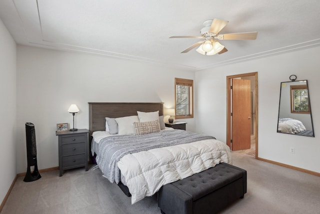 bedroom with baseboards, light colored carpet, and ceiling fan