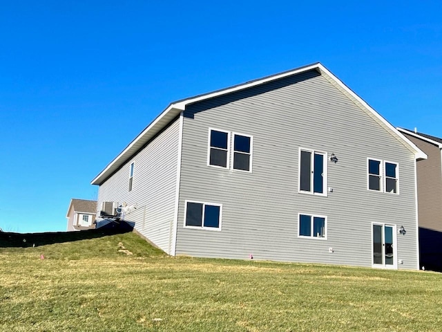 view of property exterior with a yard