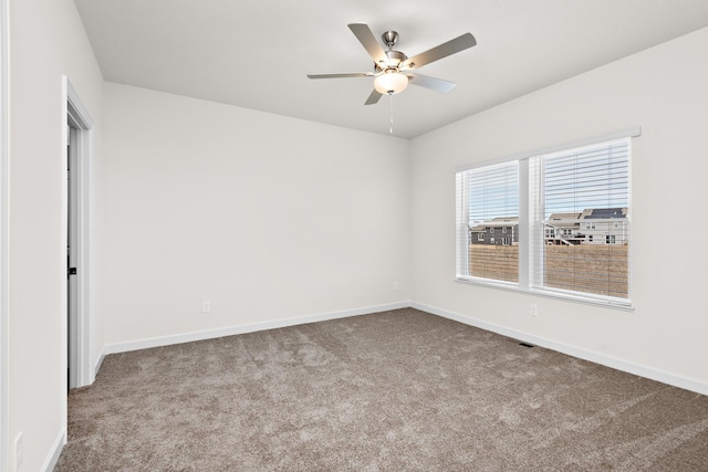 18788 Grant St NW, Elk River, MN 55330 - carpeted spare room featuring baseboards and a ceiling fan