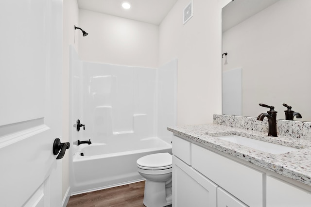 18788 Grant St NW, Elk River, MN 55330 - full bathroom with vanity, wood finished floors,  shower combination, and recessed lighting
