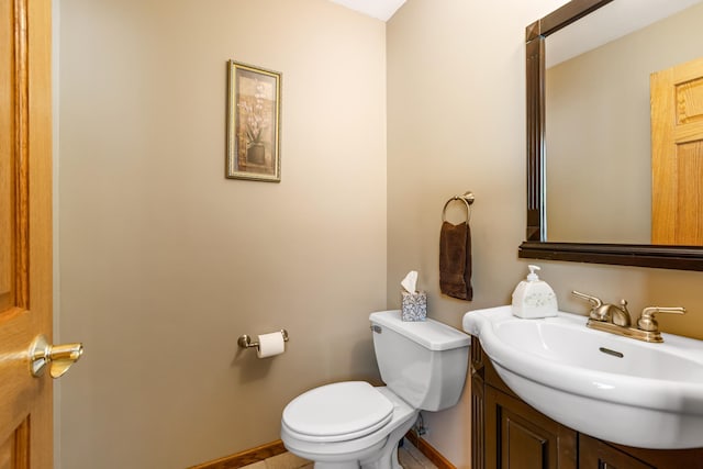 half bath with vanity and toilet