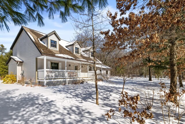 cape cod-style house with a porch