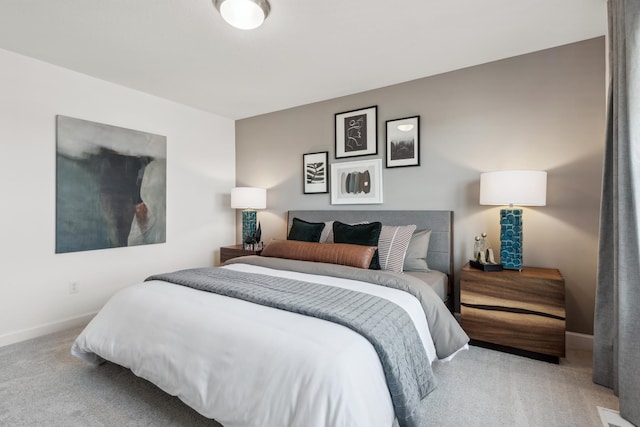 bedroom featuring carpet flooring and baseboards