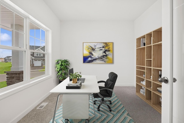 home office featuring carpet floors, baseboards, and visible vents