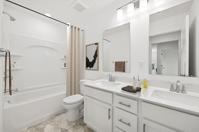 full bathroom with marble finish floor, shower / bath combo, a sink, and visible vents