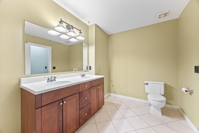 bathroom with tile patterned floors, toilet, visible vents, and a sink