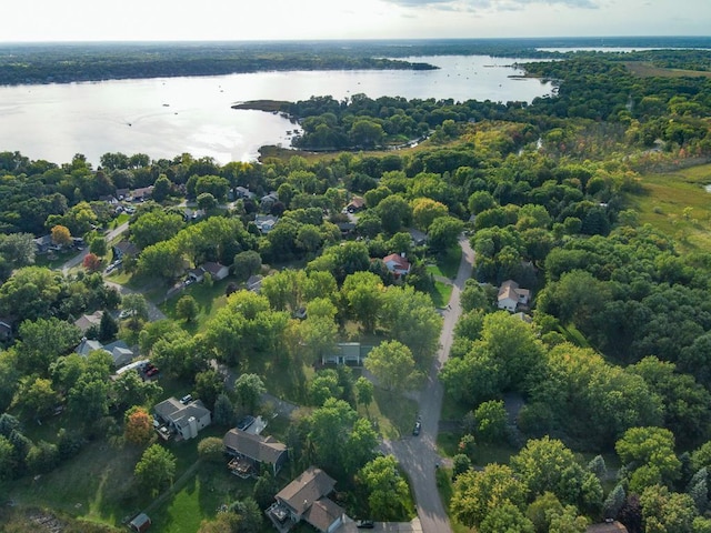 bird's eye view with a forest view and a water view