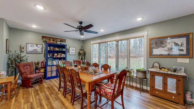 dining area featuring recessed lighting, light wood-style flooring, and baseboards