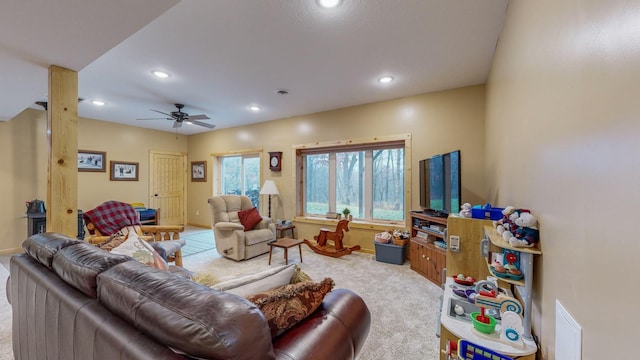 carpeted living area with baseboards, a ceiling fan, and recessed lighting